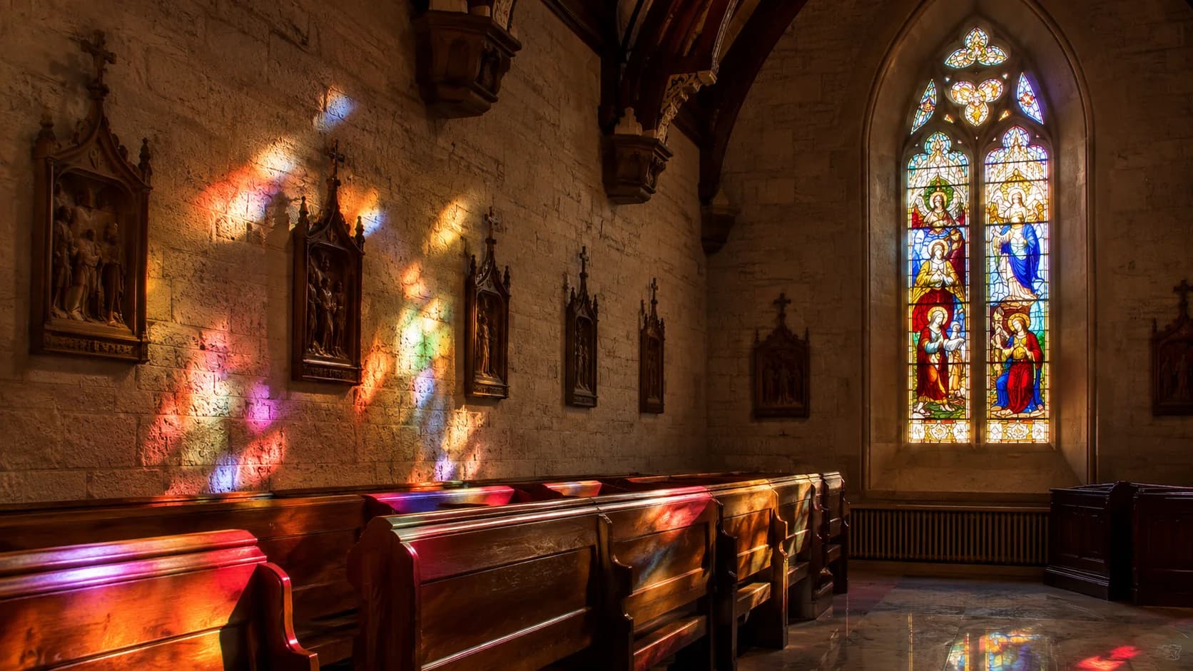 Colored stained glass light across church pews and sacred interior